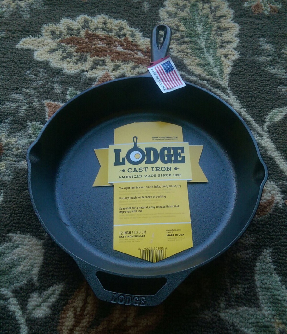 New Lodge cast iron skillet with its yellow 'American made since 1896' label still attached (12-inch model pictured; the reviewed 10.25-inch is identical in construction)