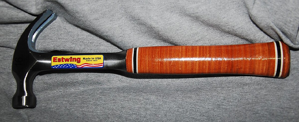 Estwing 16 oz one-piece forged steel claw hammer with stacked-leather grip — the leather-handled sibling of the E3-16S — showing the Made in USA label